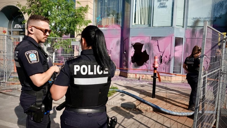 Police outside Marc Miller's vandalized constituency office