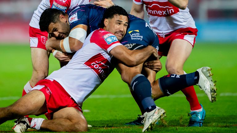 Picture by Allan McKenzie/SWpix.com - 20/09/2024 - Rugby League - Betfred Super League Round 27 - Hull KR v Leeds Rhinos - Sewell Group Craven Park, Hull, England - Leeds' Rhyse Martin is tackled by Huill KR's Peta Hiku, Matt Parcell & James Batchelor.