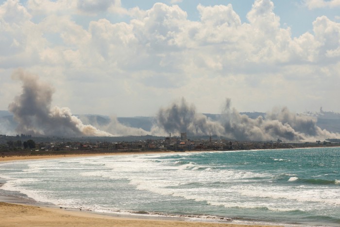 Smoke billows over southern Lebanon near the sea following Israeli strikes on Monday