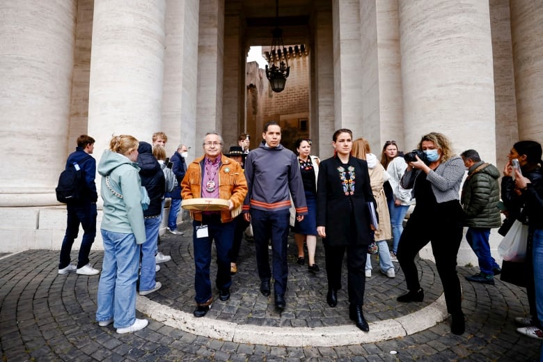 From left to right: Assembly of First Nations Northwest Territories Regional Chief Gerald Antoine, Inuit Tapiriit Kanatami President Natan Obed,and Métis National Council President Cassidy Caron walk in St. Peter's Square after an April 2022 audience with Pope Francis.