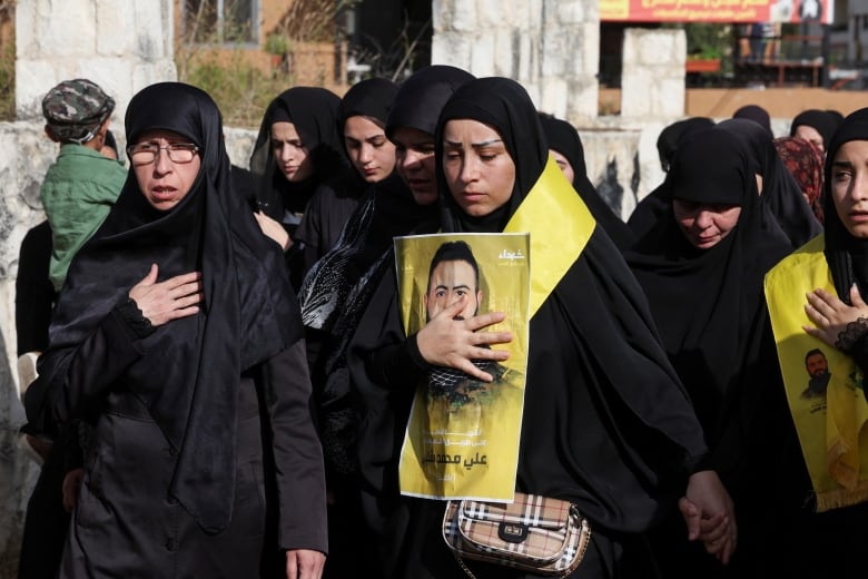 Mourners attend the funeral of Hezbollah member Ali Mohamed Chalbi, after hand-held radios and pagers used by Hezbollah detonated across Lebanon, in Kfar Melki, Lebanon September 19, 2024.