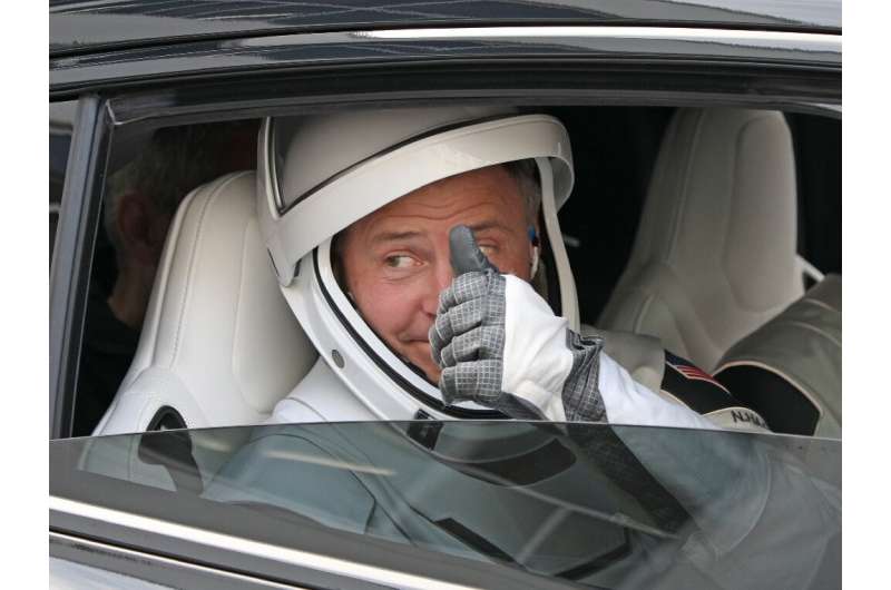 Flight commander Nick Hague of NASA gives a thumbs up to family members before heading to the launch pad at the Kennedy Space Center in Florida