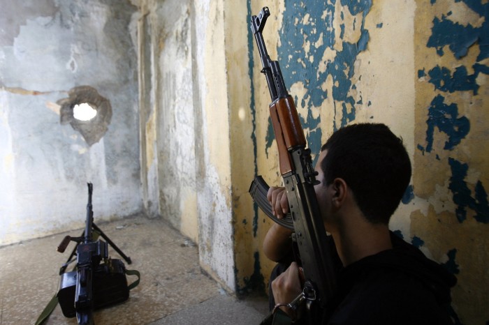 A member of Hizbollah holding a gun