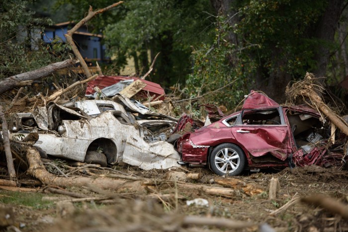 Destroyed vehicles lay near what used to be Mill Creek in Old Fort, North Carolina.