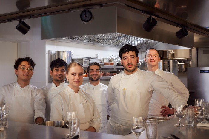 Pierre Touitou (second from right) and his team at 19 Saint Roch in Paris