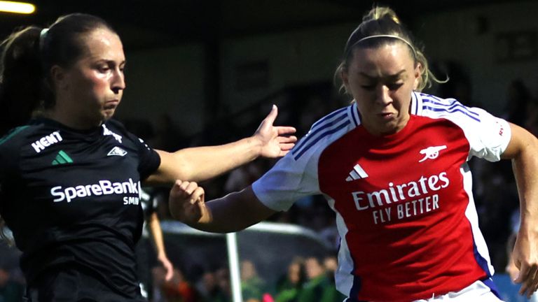 Rosenborg's Mathilde Rogde (left) and Arsenal's Katie McCabe battle for the ball