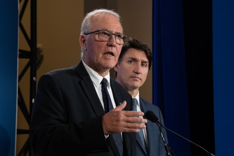 Prime Minister Justin Trudeau looks on as National Defence Minister Bill Blair responds to a question during a news conference at the NATO Summit Thursday, July 11, 2024 in Washington.