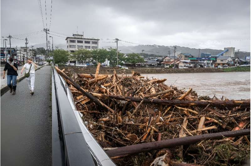 Debris from flooding piles up at a bridge in Wajima city, which has recorded more than 540 mm of rainfall in the 72 hours to Sunday morning