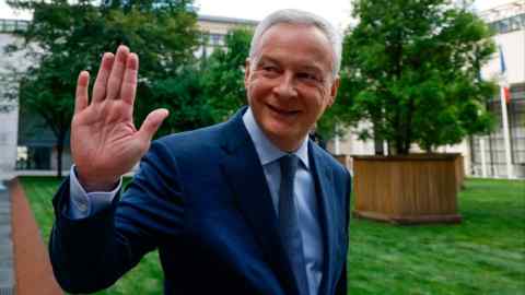 Bruno Le Maire waves after attending a farewell ceremony