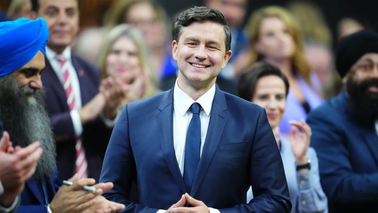 A man stands in the House of Commons.