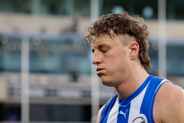 Nick Larkey of the Kangaroos leaves the field looking dejected after round 22.