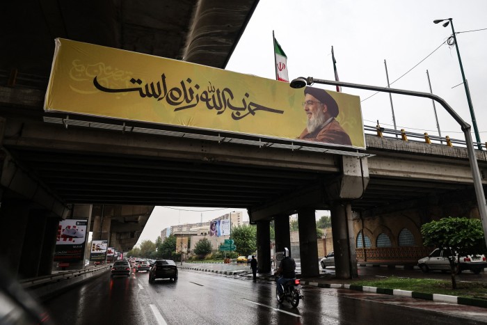 A banner declaring that  ‘Hizbollah is alive’ hangs along a Tehran bridge on Saturday