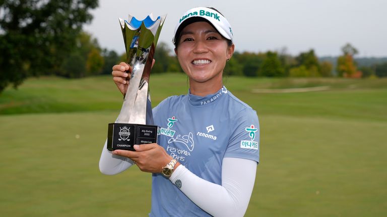 Lydia Ko, of New Zealand, poses for photos with the trophy after winning the LPGA Kroger Queen City Championship golf tournament at TPC River's Bend in Maineville, Ohio, Sunday, Sept. 22, 2024. (AP Photo/Carolyn Kaster)