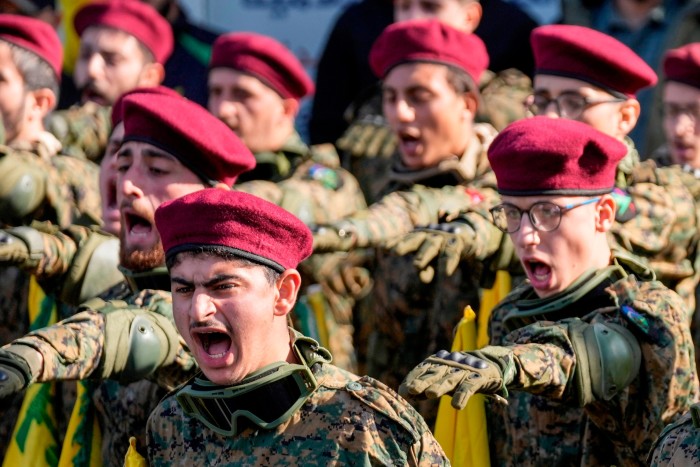 Fighters in camouflage dress and military berets