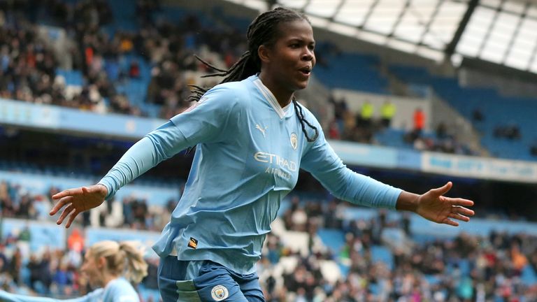 Man City's Bunny Shaw celebrates scoring their third goal against Man Utd