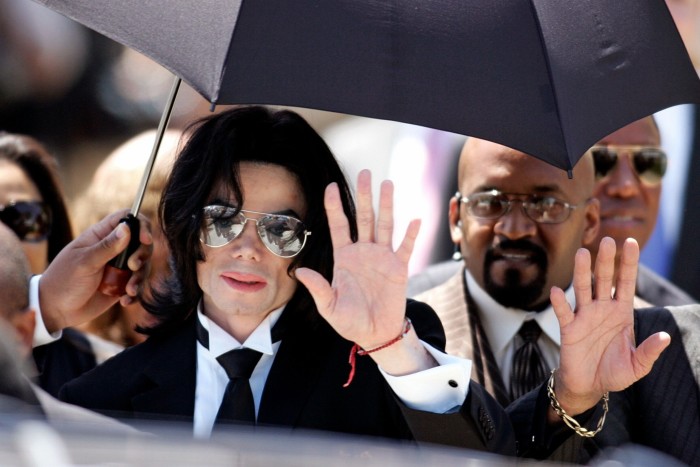 Michael Jackson waves after being acquitted in a 2005 case