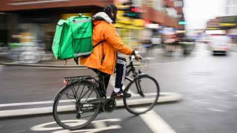 A delivery rider travels through the Hammersmith