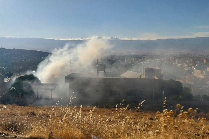 Smoke billows from a house in Baalbek in east Lebanon after a reported explosion of a radio device