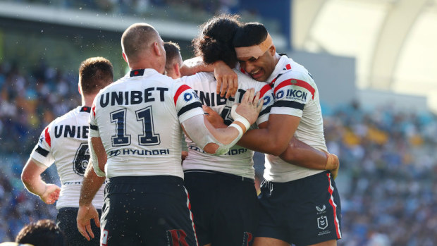 Sitili Tupouniua of the Roosters celebrates a try.