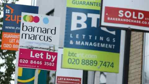 Estate agent and letting signs in London, including those from Barnard Marcus, BTC Lettings & Management, and others. The signs display information about properties for sale and rent.