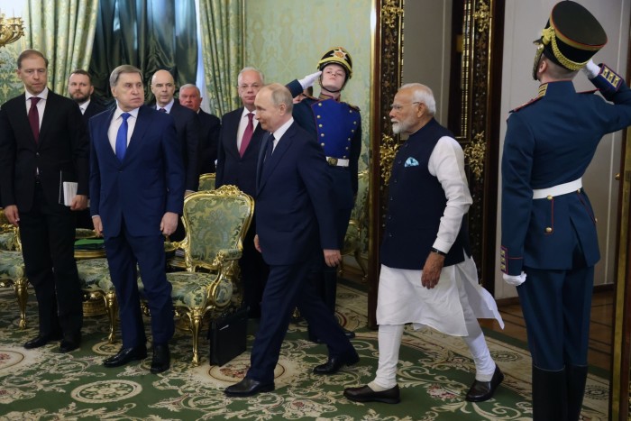 Vladimir Putin and Narendra Modi enter a hall in Grand Kremlin Palace, Moscow 