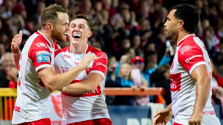 Picture by Allan McKenzie/SWpix.com - 20/09/2024 - Rugby League - Betfred Super League Round 27 - Hull KR v Leeds Rhinos - Sewell Group Craven Park, Hull, England - Hull KR's Joe Burgess celebrates his try against Leeds with Jack Broadbent and Peta Hiku.