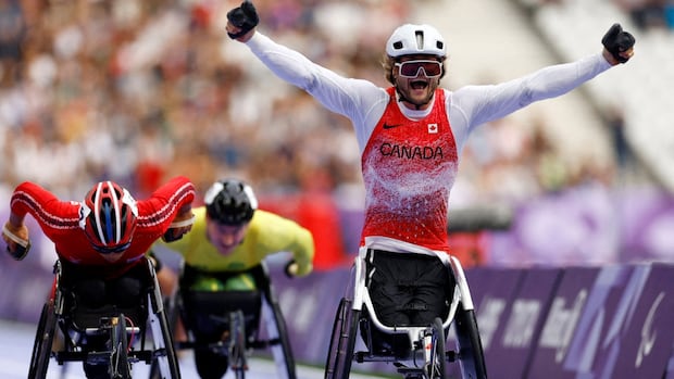 Austin Smeenk of Canada celebrates after winning Paralympic gold.