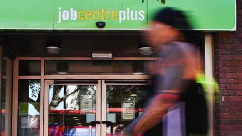 A person walks past a Jobcentre Plus