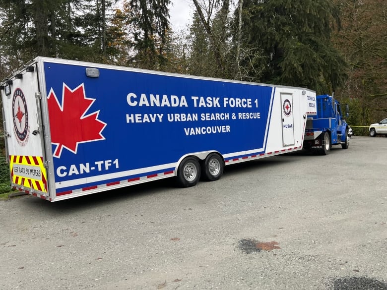 A truck reading 'Canada Task Force 1 Heavy Urban Search and Rescue.'