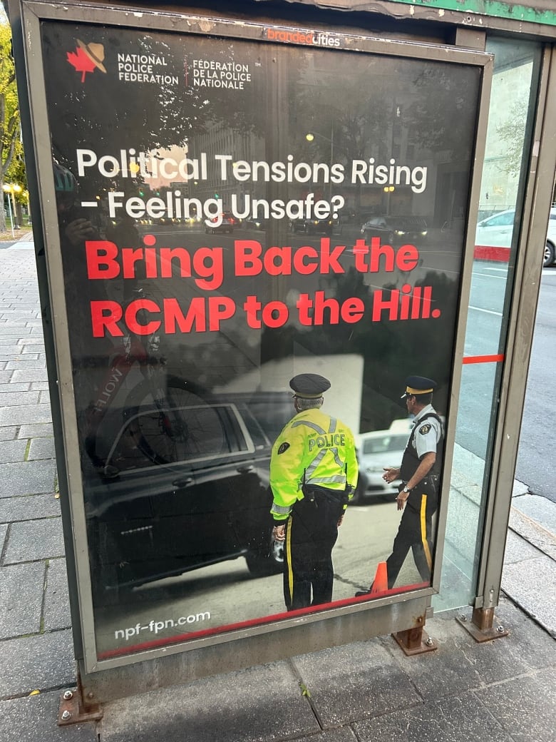 An RCMP poster at a bus shelter calls on politicians in Ottawa to "bring back the RCMP to the Hill" and replace the current Parliamentary Protection Service as the agency responsible for security across the parliamentary precinct. 