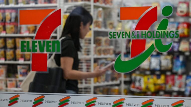 7-Eleven’s parent company cuts full-year earnings forecast