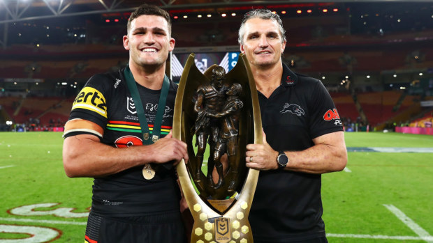 Nathan and Ivan Cleary holding the premiership trophy.