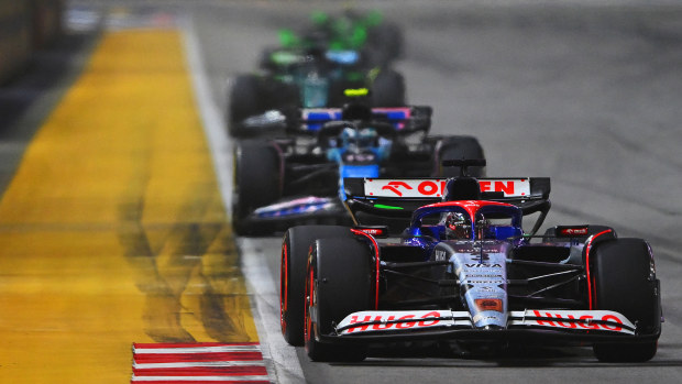 Daniel Ricciardo of Australia driving the (3) Visa Cash App RB VCARB 01 leads Pierre Gasly of France driving the (10) Alpine F1 A524 Renault on track during the F1 Grand Prix of Singapore at Marina Bay Street Circuit on September 22, 2024 in Singapore, Singapore. (Photo by Rudy Carezzevoli/Getty Images)