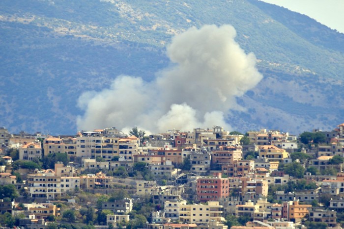 Smoke billows from the site of an Israeli airstrike in the southern Lebanese village of Khiam near the border on September 19