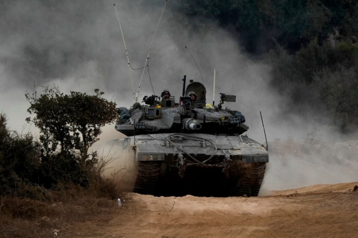 Israeli army tanks manoeuvre in a staging area in northern Israel near the Israel-Lebanon border, 