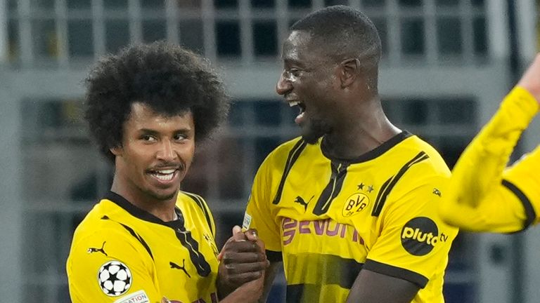 Dortmund's Karim Adeyemi (left) celebrates with Serhou Guirassy after completing his hat-trick against Celtic