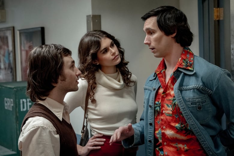 This image released by Sony Pictures shows Gabriel LaBelle as Lorne Michaels, left, Kaia Gerber as Jacqueline Carlin, center, and Cory Michael Smith as Chevy Chase in a scene from "Saturday Night."  (Hopper Stone/Sony Pictures via AP)