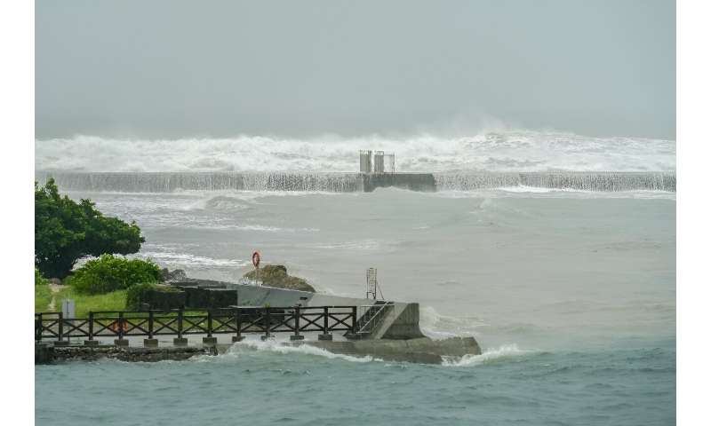 Waves break at Sizihwan beach in Kaohsiung on Wednesday, as Typhoon Krathon bears down on Taiwan