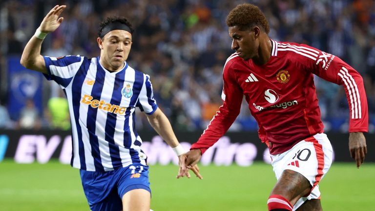 Manchester United's Marcus Rashford tries to drive the ball past Porto's Pepe, left, during a Europa League opening phase soccer match between FC Porto and Manchester United at the Dragao stadium in Porto, Portugal, Thursday, Oct. 3, 2024. (AP Photo/Luis Vieira)