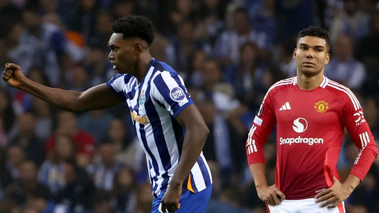 Porto's Samu Omorodion celebrates next to Manchester United's Casemiro, right, after scoring his side's third goal during a Europa League opening phase soccer match between FC Porto and Manchester United at the Dragao stadium in Porto, Portugal, Thursday, Oct. 3, 2024. (AP Photo/Luis Vieira)