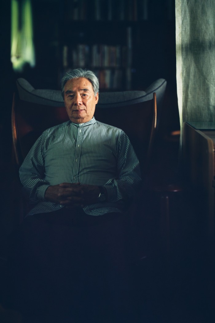 Oda sits in a Chieftain Chair, created by Danish designer Finn Juhl in 1949