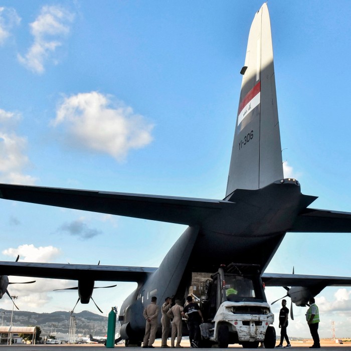 Medical aid provided by Iraq to Lebanon is unloaded off of an Iraqi Air Force C-130 Hercules military transport aircraft at Beirut International Airport last month