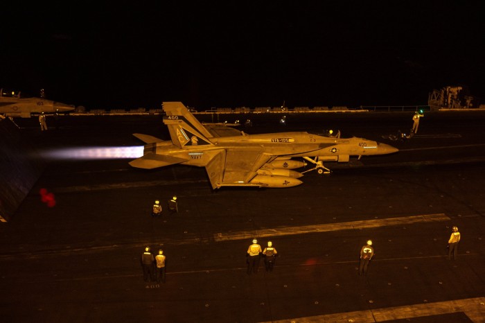 A fighter jet takes off from a US aircraft carrier during operations in the Red Sea