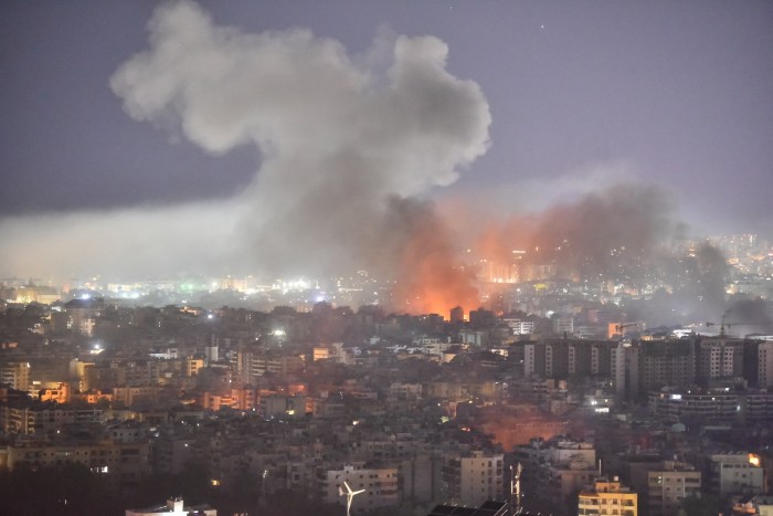 Smoke rises from the site of an Israeli airstrike in a suburb of Beirut on Thursday