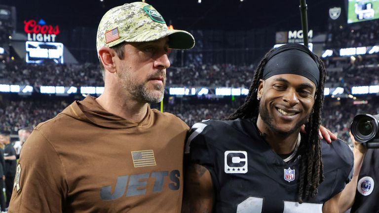 Quarterback Aaron Rodgers of the New York Jets and wide receiver Davante Adams of the Las Vegas Raiders