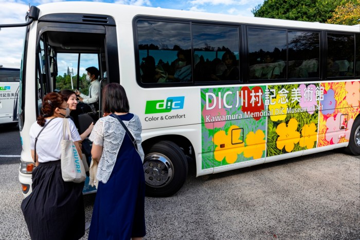 People line up to board the special museum shuttle bus at Kawamura