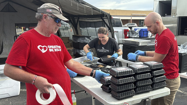 Volunteers for Operation BBQ Relief prepare meals for people without power or water, Oct. 1, 2024, in Augusta, Georgia. (AP Photo / Jeffrey Collins)