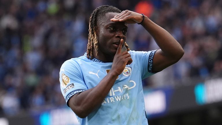 Manchester City's Jeremy Doku celebrates scoring his side's third goal against Fulham