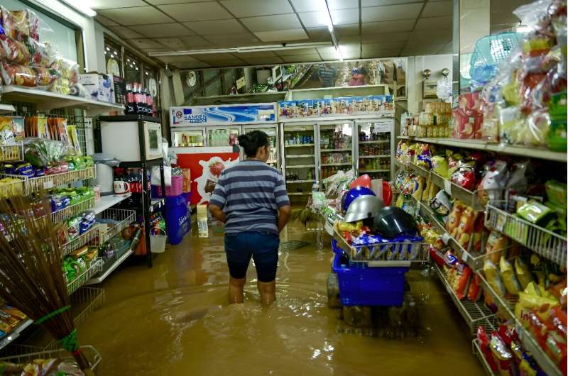 A flooded convenience store in Thailand's tourist hotspot of Chiang Mai