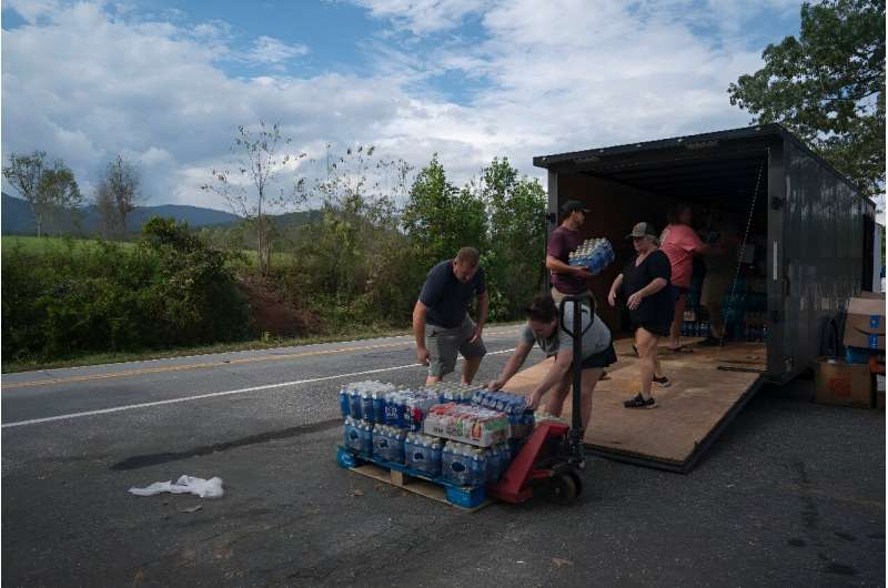 Relief officials unload bottled water in North Carolina on October 3, 2024